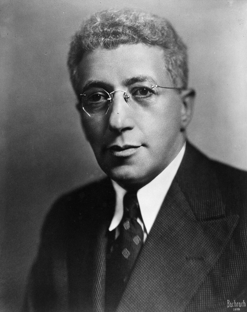 black and white photo of B.C. Vladeck - headshot in a suit
